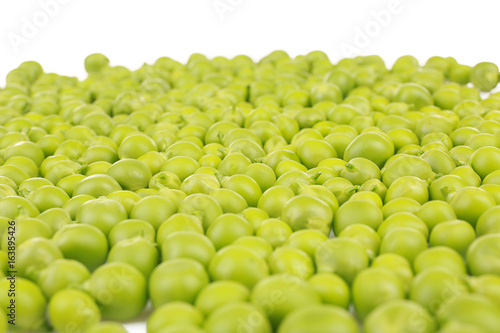 Pile of fresh green peas on white background, closeup © Africa Studio