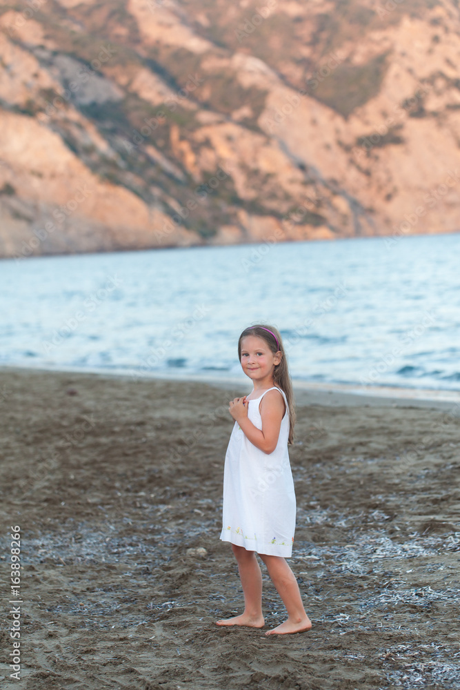 Cute girl walking on a beach