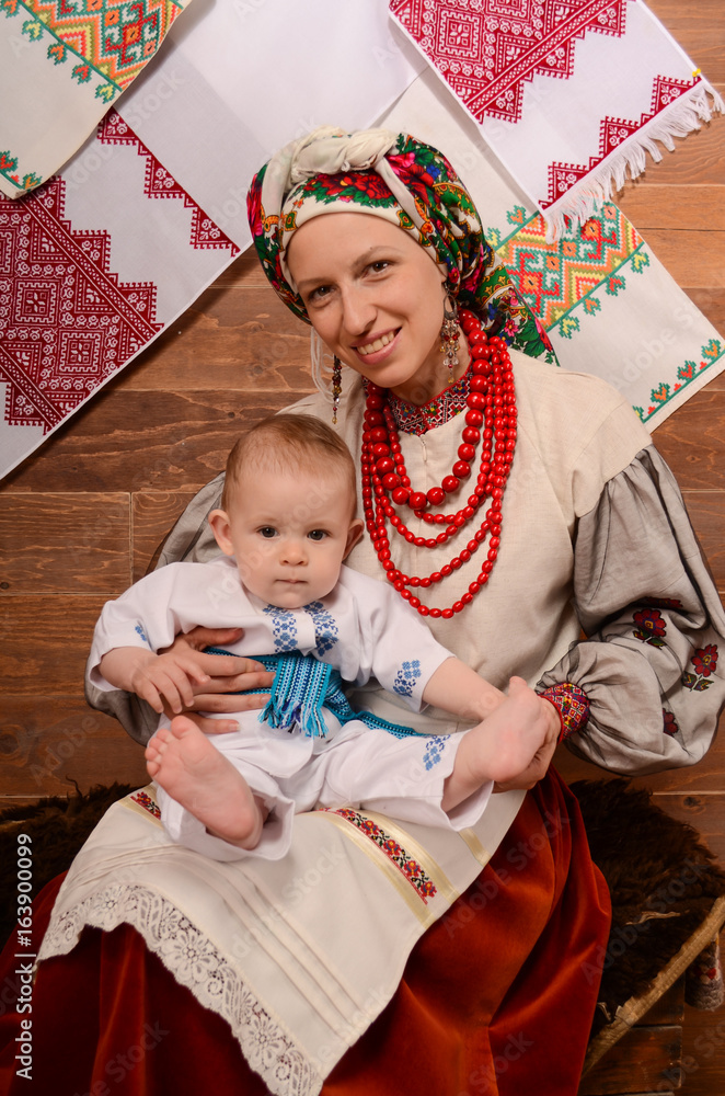 Ukrainian mother and child in national costumes