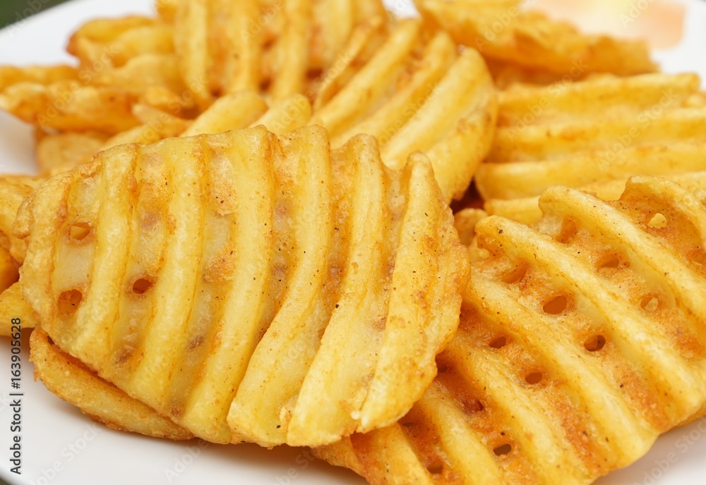 Potato slices in grid cut on white background Potato slices in grid cut on white background