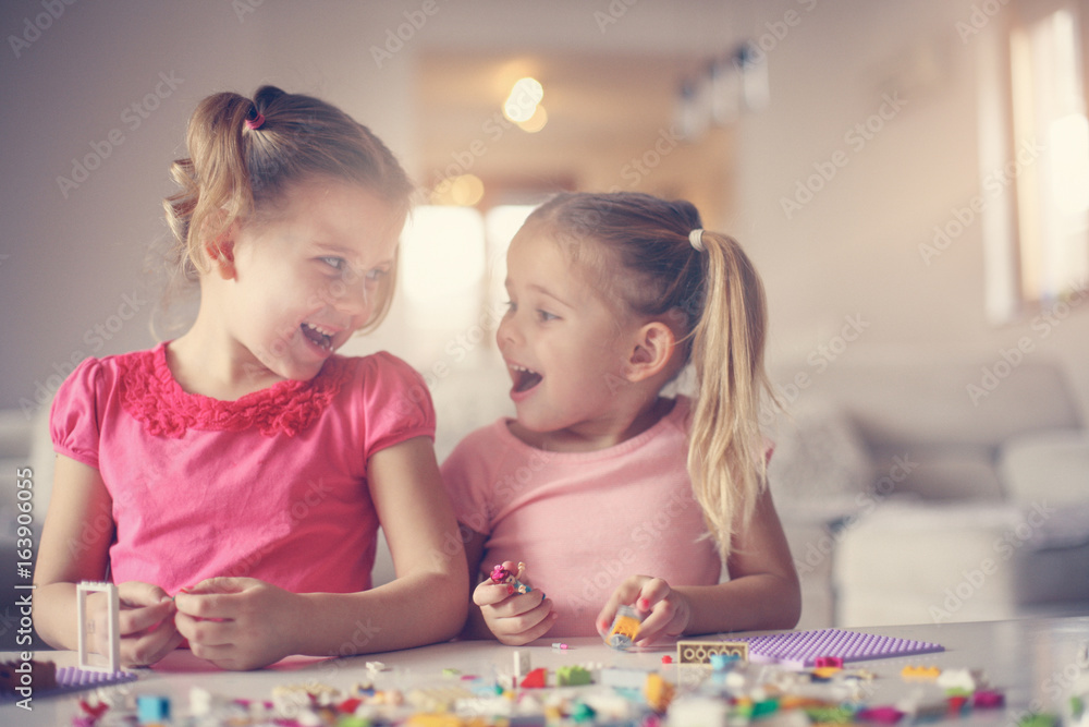 Fototapeta premium Girls playing at home.