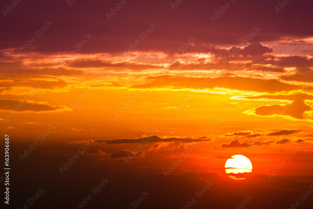 sun ray is go down and amazing dramatic  orange cloud, twilight sky