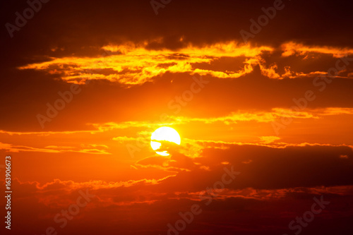 sun ray is go down and amazing dramatic  orange cloud, twilight sky