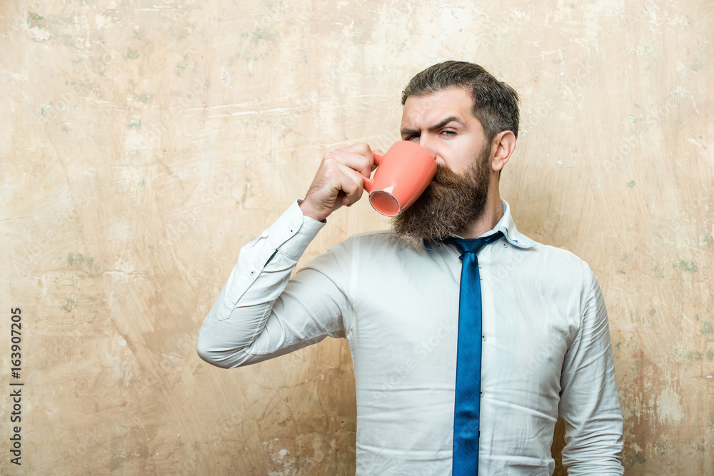 man with serious face drink tea from coffee cup man with serious face drink tea from coffee cup