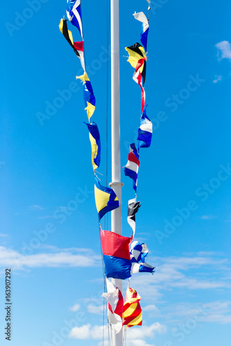 St. Petersburg, Russia - 28 June 2017: Sea flags on the pier in St. Petersburg. photo