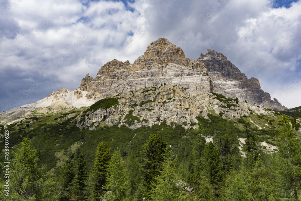 Tre Cime di Lavaredo on a background of clouds. Dolomites. Italy.