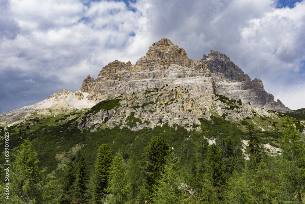Tre Cime di Lavaredo on a background of clouds. Dolomites. Italy. Tre Cime di Lavaredo on a background of clouds. Dolomites. Italy.