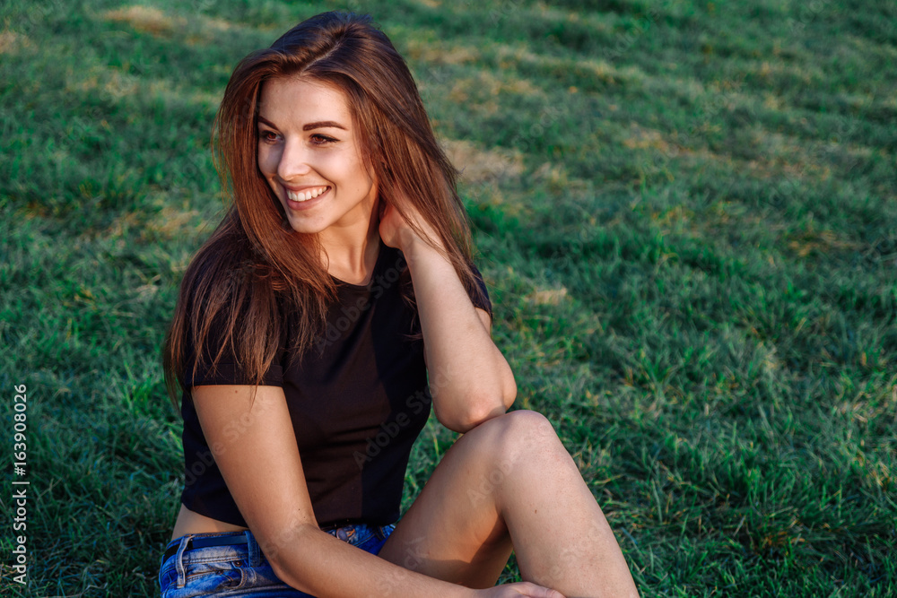 Summer spring portrait of young beautiful woman smile in the park sunset Summer spring portrait of young beautiful woman smile in the park sunset
