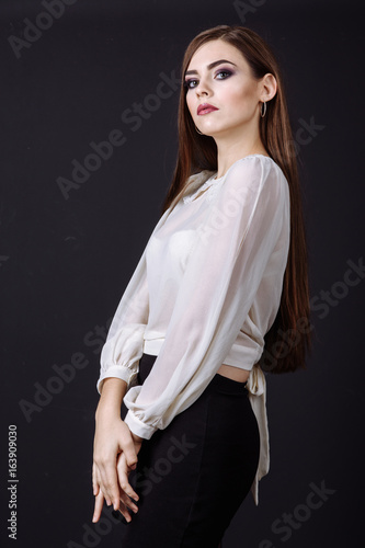 Beautiful girl model posing studio photo