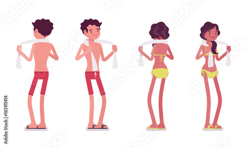 Young man and woman in summer beach outfit, standing