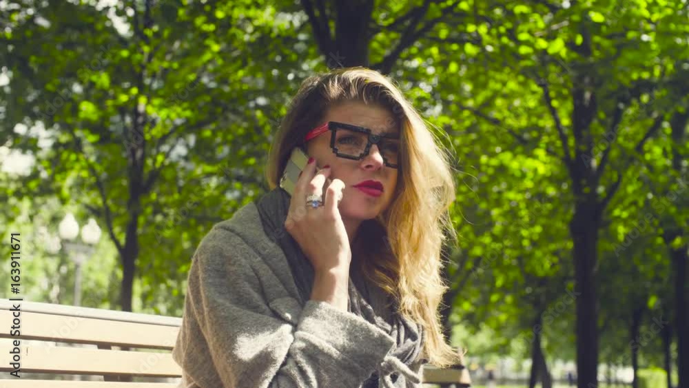 Portrait of young woman talking by smartphone Portrait of young woman talking by smartphone