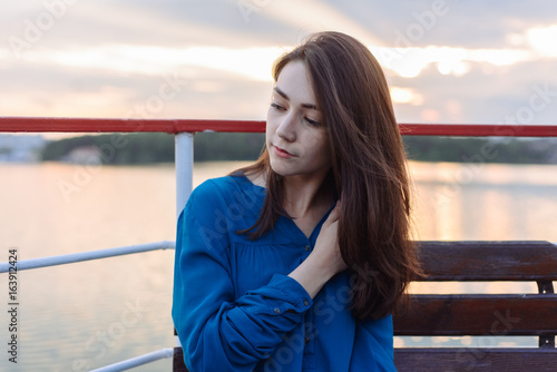 Summer happy portrait beautiful woman girl caucasian asian blended in blue shirt posing on background sky lake water sunset long hair brunette outdoors Free Download Summer happy portrait beautiful woman girl caucasian asian blended in blue shirt posing on background sky lake water sunset long hair brunette outdoors - GFXLoad