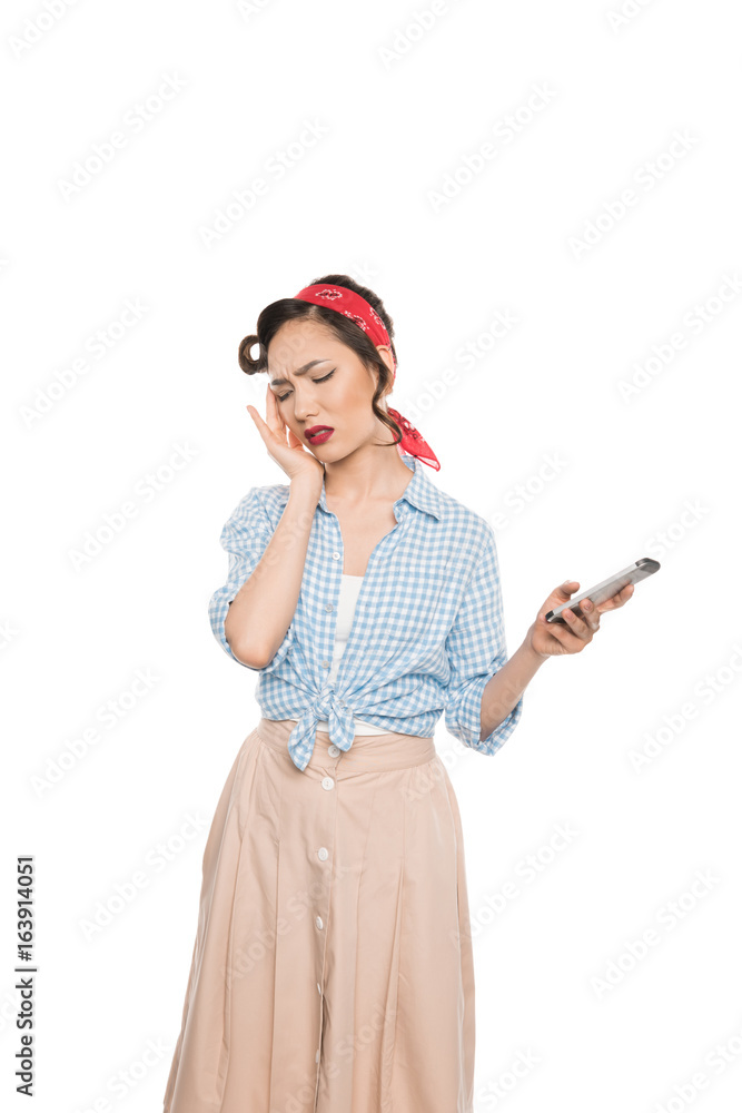Attractive asian woman with headache holding smartphone isolated on white Attractive asian woman with headache holding smartphone isolated on white