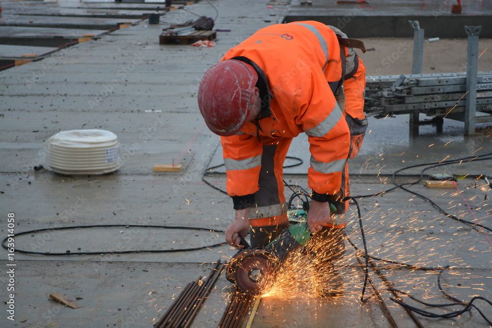 Construction worker with power saw Construction worker with power saw