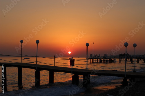 sunset on the beach  romantic time  lovelu sky  ocean  dusk  clouds  romantic  lovely   bridge  colors  