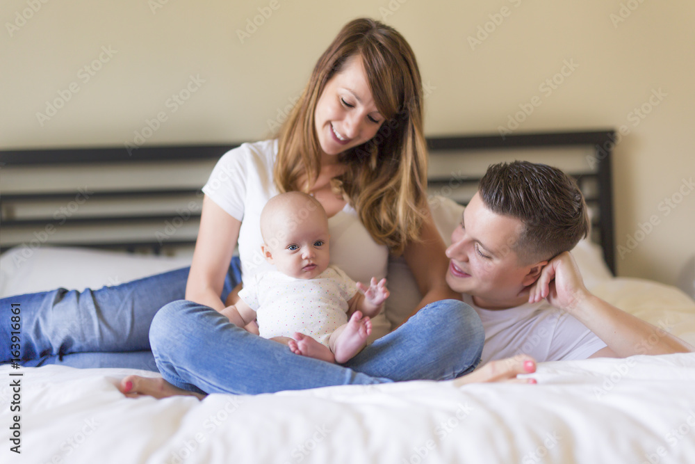 Portrait of parent with her 3 month old baby in bedroom Portrait of parent with her 3 month old baby in bedroom