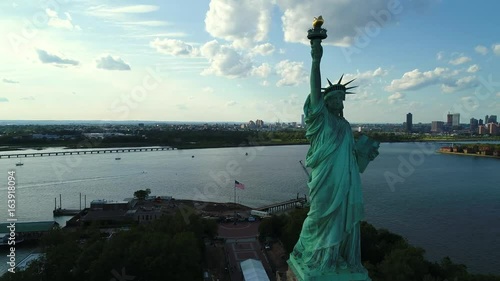 Aerial drone orbit Statue of Liberty reveal New York City