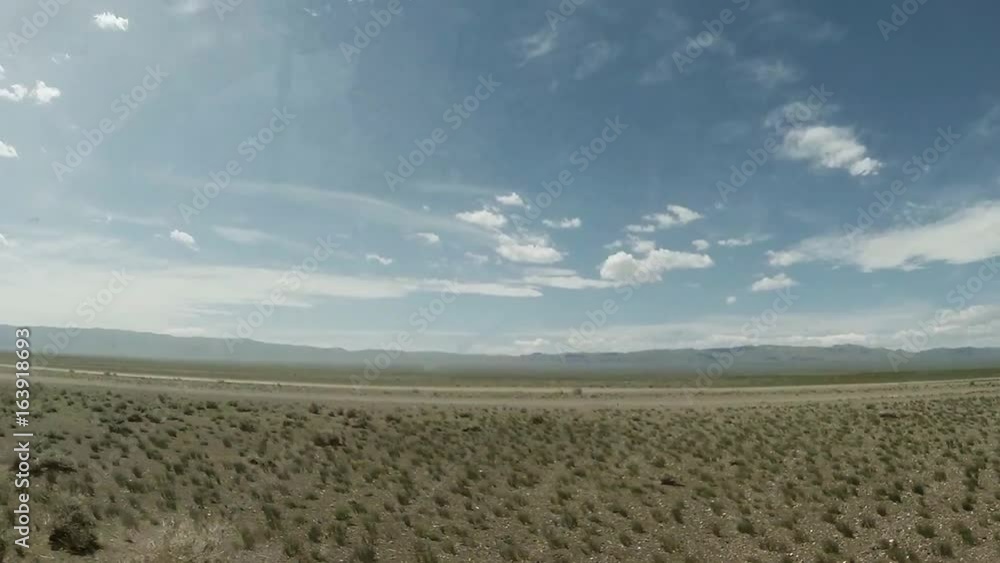 Black Suv Rushing Through the Mongolian Savannah Can be Seen Through the Glass of the Driving Car Black Suv Rushing Through the Mongolian Savannah Can be Seen Through the Glass of the Driving Car