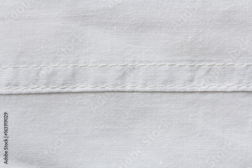 White natural cotton cloth texture with horizontal seam photo