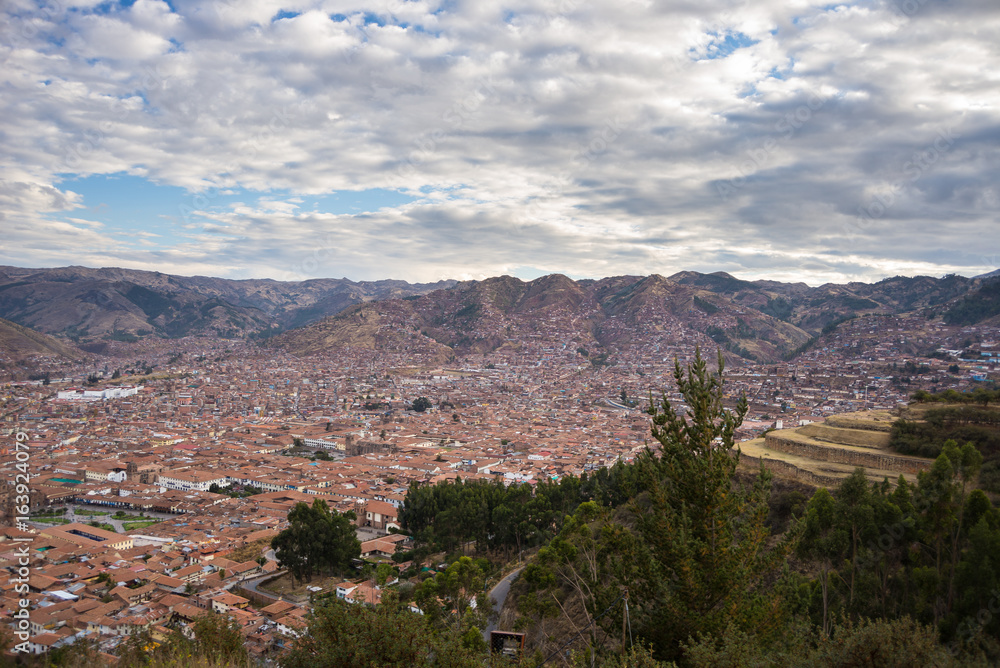 Expansive cityscape of Cusco town with scenic cloudscape. Cusco is among the most important travel destination in Peru and the entire South America.