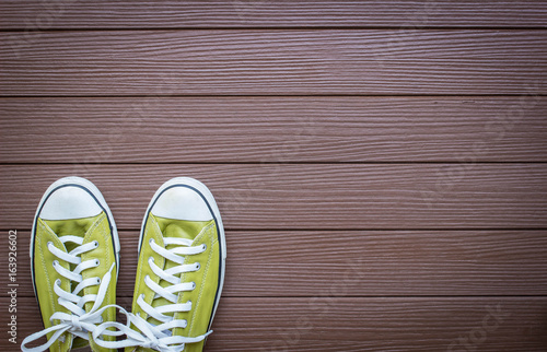Shoes on wood background with copy space , top view