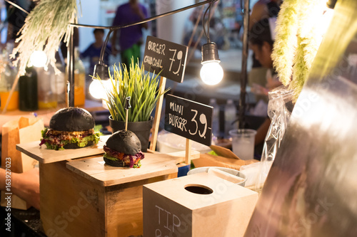 Black hamburgers are sold in street markets in Phuket.