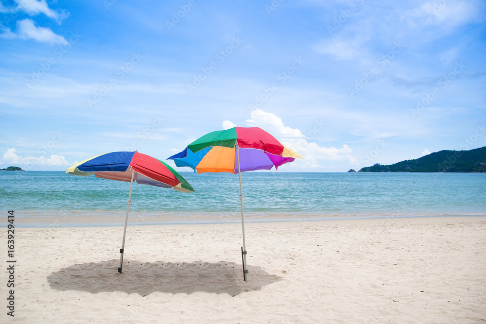 Chairs and umbrella in  beach - tropical holiday.