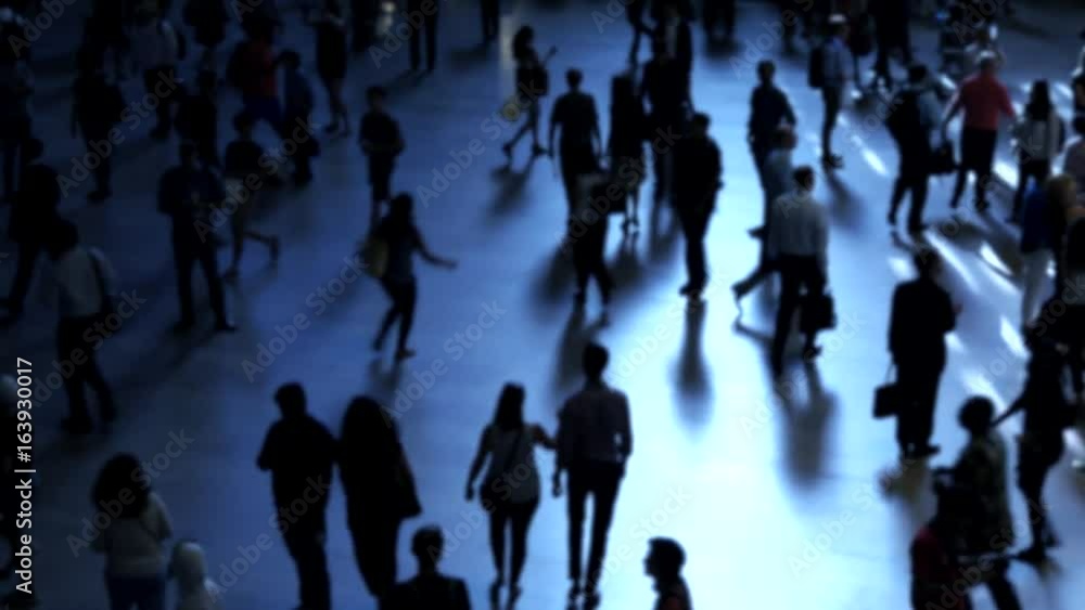 crowd of people commuting in the city. pedestrians walking on crowded street at rush hour time crowd of people commuting in the city. pedestrians walking on crowded street at rush hour time