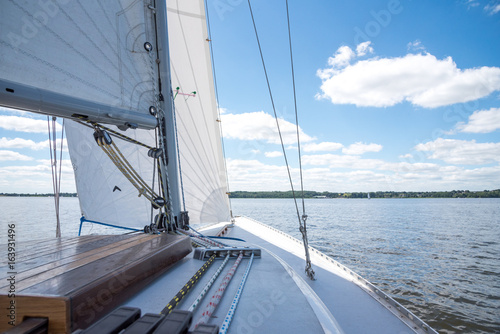 Sail boat sailing on the river Schlei in Germany on a sunny day