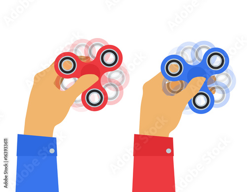 two human hands holding fidget spinners on white background