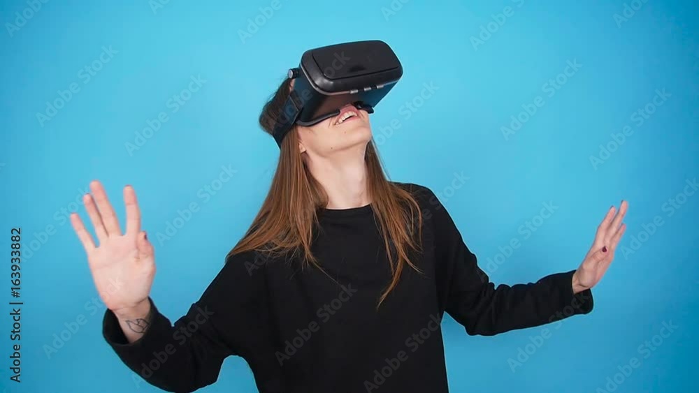 Young Woman using the virtual reality headset Young Woman using the virtual reality headset