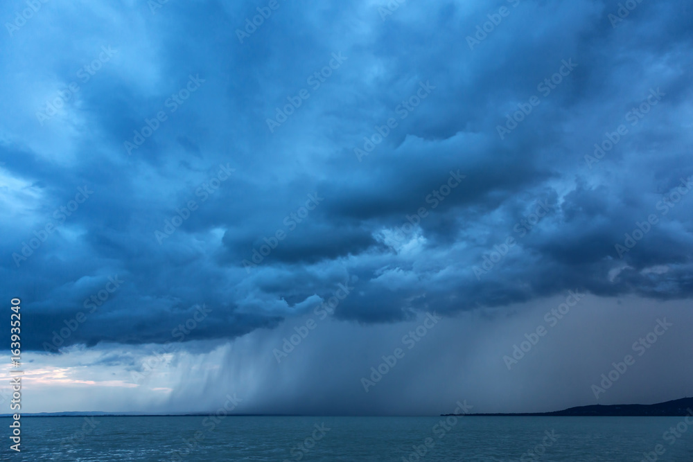 Big powerful storm clouds over tke Lake Balaton of Hungary