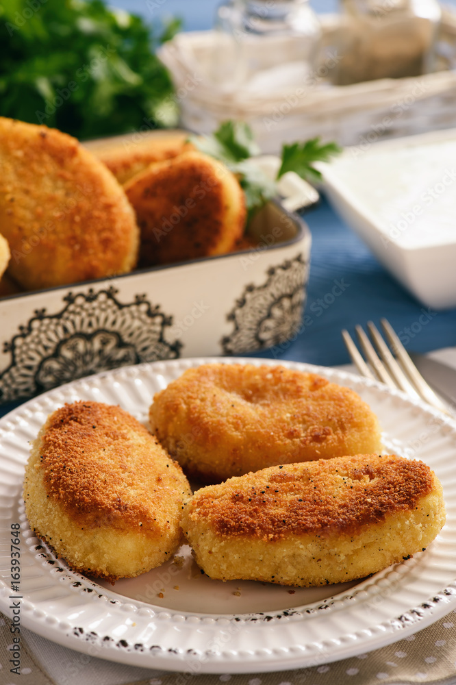 Potato croquettes stuffed with mozzarella and garlic sauce. Potato croquettes stuffed with mozzarella and garlic sauce.