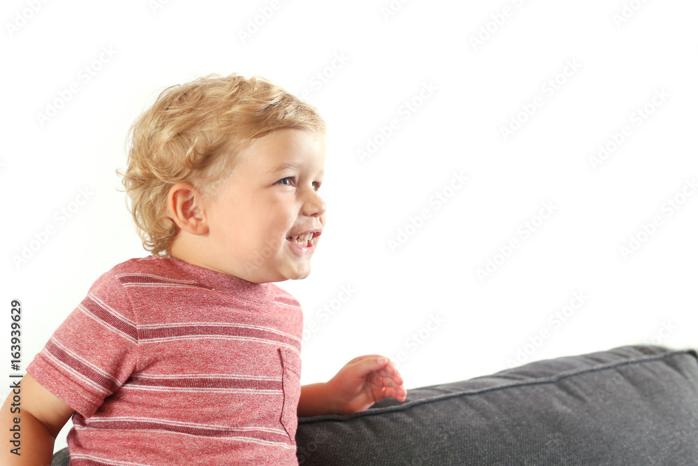 Cute Blonde Boy Plays on a couch Cute Blonde Boy Plays on a couch