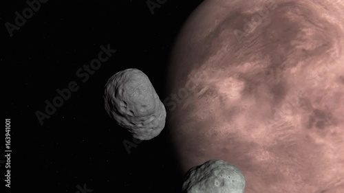An asteroid is passing by and almost colliding with Mars moon Phobos