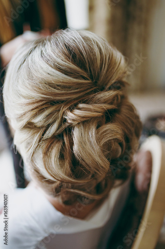 Hairstyle of the bride. Beautiful wedding hairstyle for the bride. Large with details