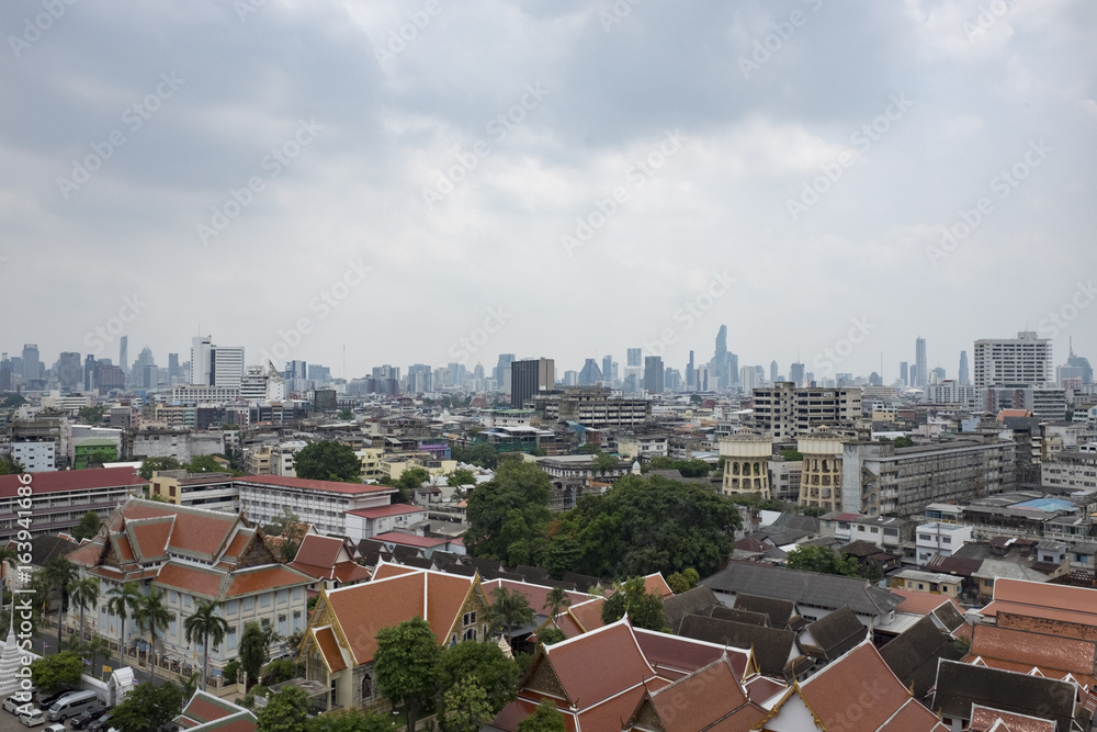 Panorama view of Bangkok from Golden Mountain on sunset cloudy sky, Thailand. Traditional architecture of Bangkok from the height of bird flight.