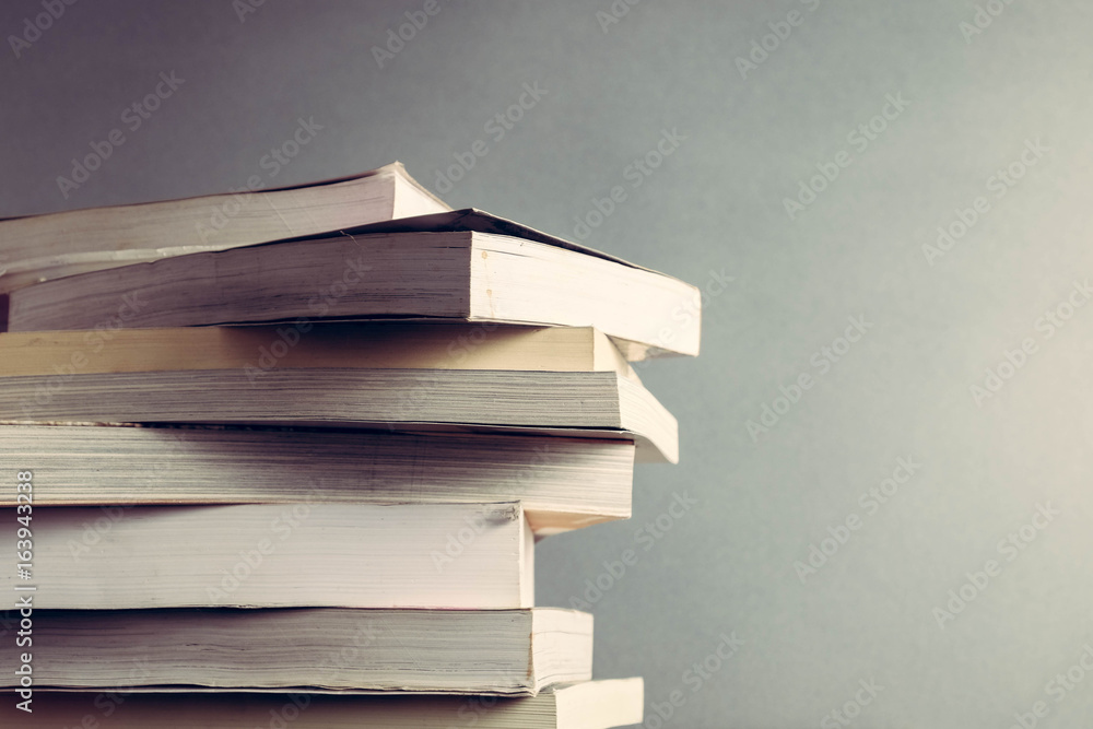 The book is on a wooden table with filter effect retro vintage style The book is on a wooden table with filter effect retro vintage style