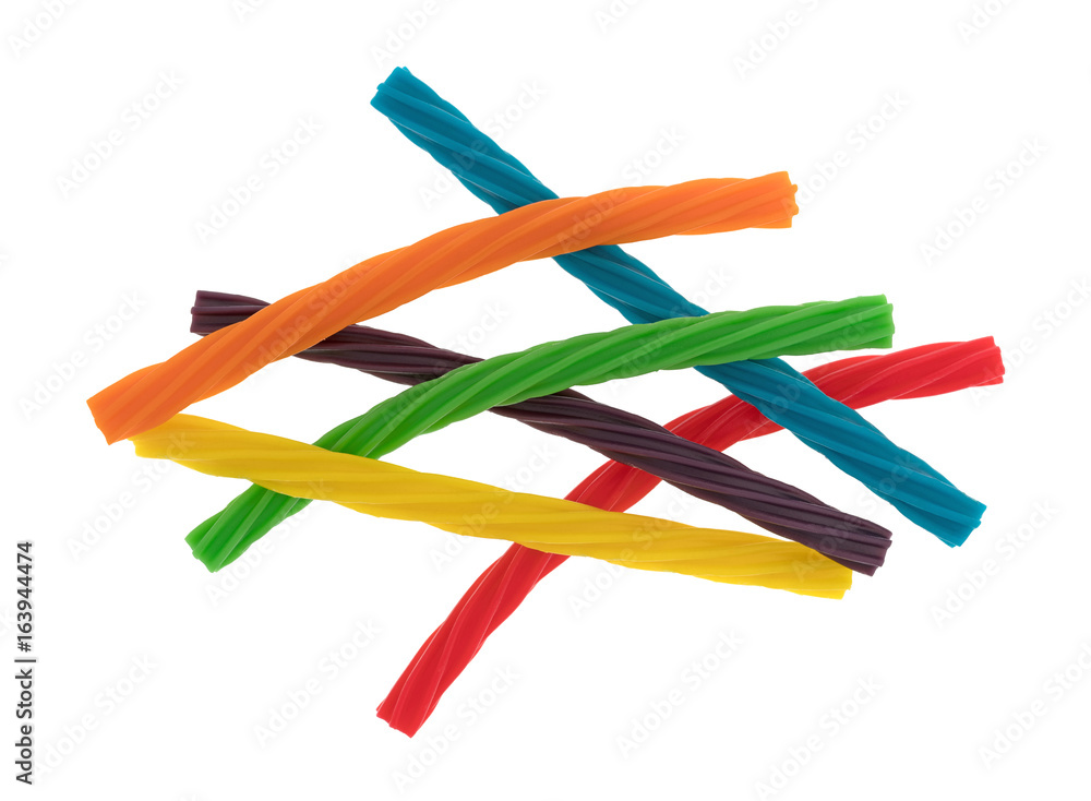 Top view of colorful spiral licorice sticks in a jumble isolated on a