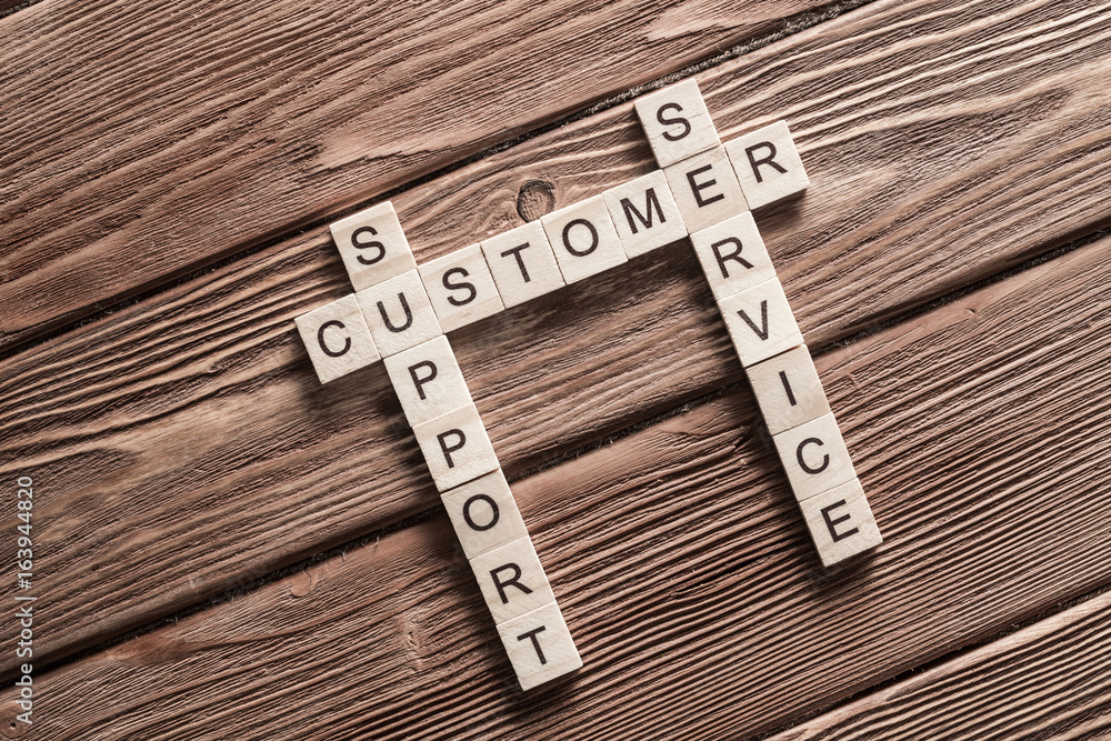 Conceptual business keywords on table with elements of game making crossword Conceptual business keywords on table with elements of game making crossword