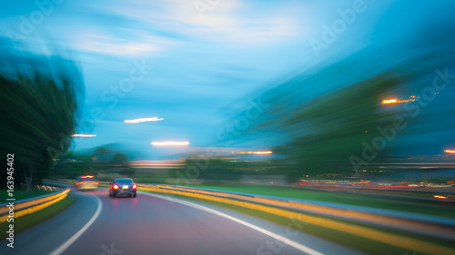 Abstract blurred of the car on the road at night time-Transportation concept.