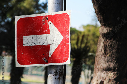 A South African road sign(one way only) attached to a steel pole. 