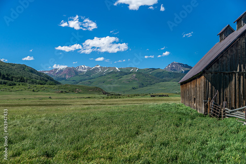 Barn in meadow in high Rocky Mountains