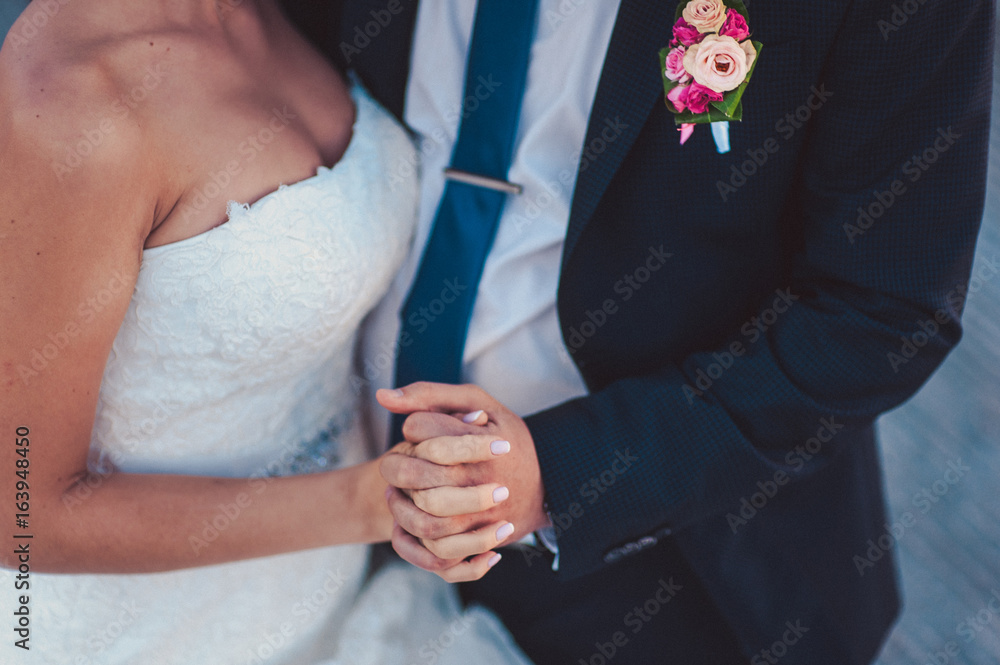 Holding hands. Closeup view of married couple holding hands Holding hands. Closeup view of married couple holding hands