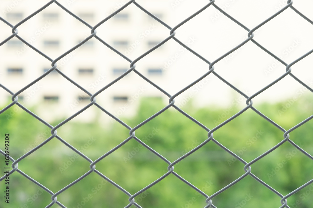 blur and soft focus steel net with the blur condominium and town home in the city. blur background. blur and soft focus steel net with the blur condominium and town home in the city. blur background.