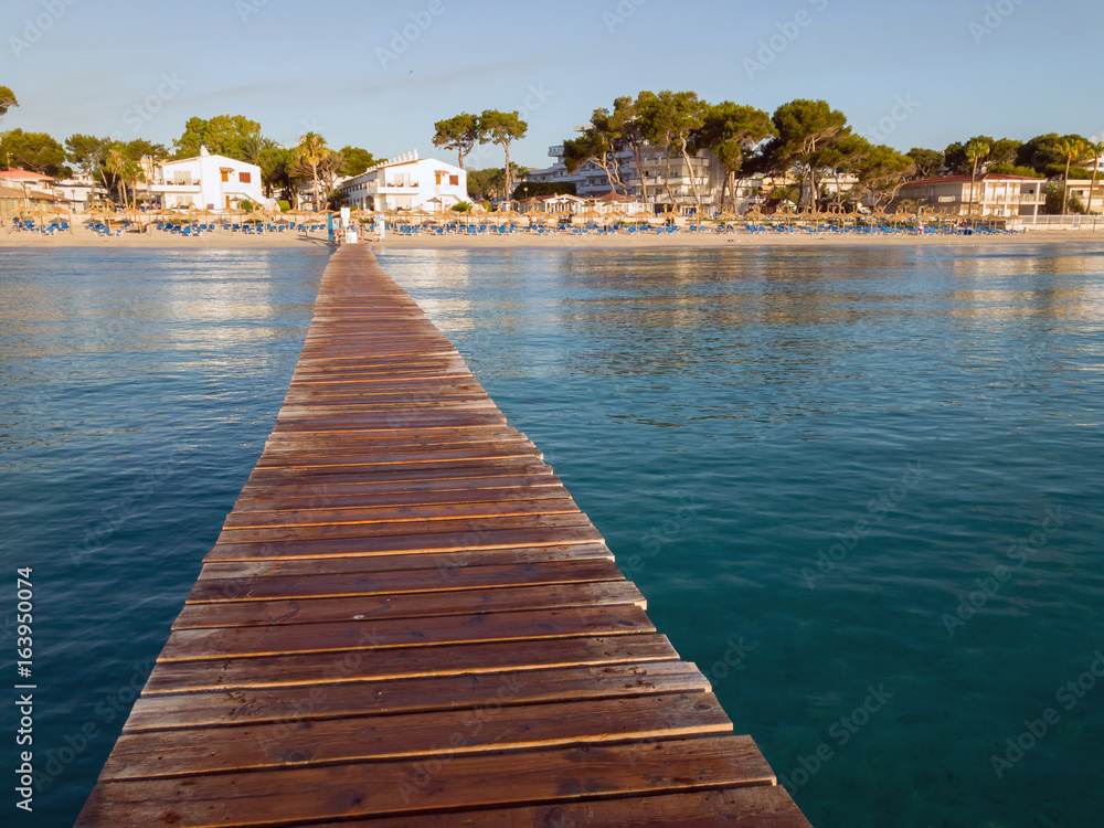 Playa de Muro, Mallorca, Balearic islands. Beatiful wooden boards pier