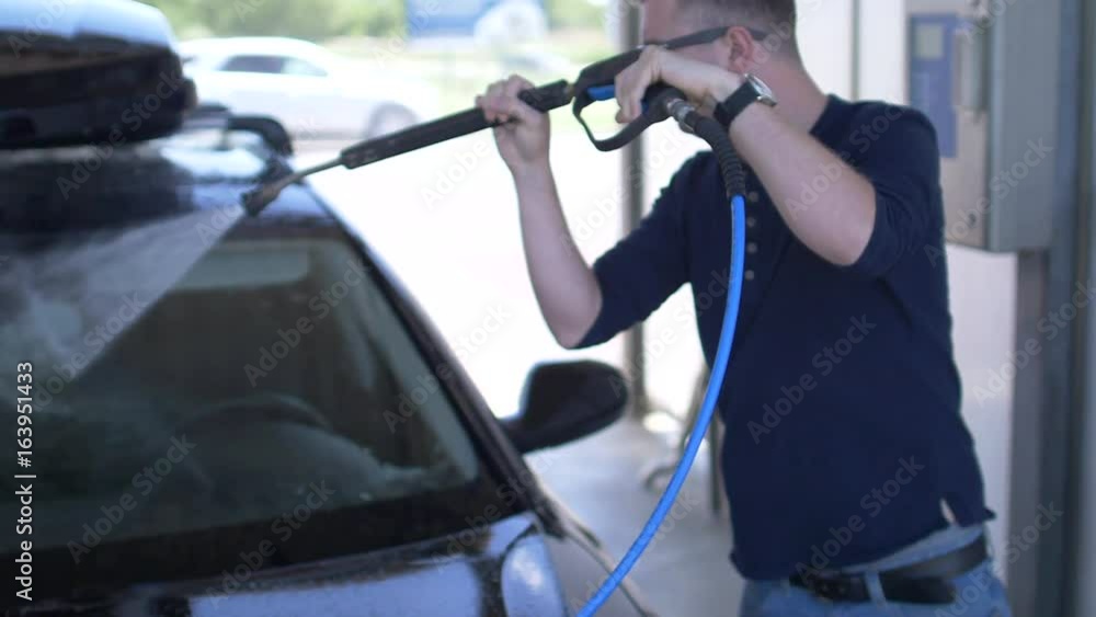 Car Washing. Cleaning Modern Vehicle in Slow Motion Car Washing. Cleaning Modern Vehicle in Slow Motion
