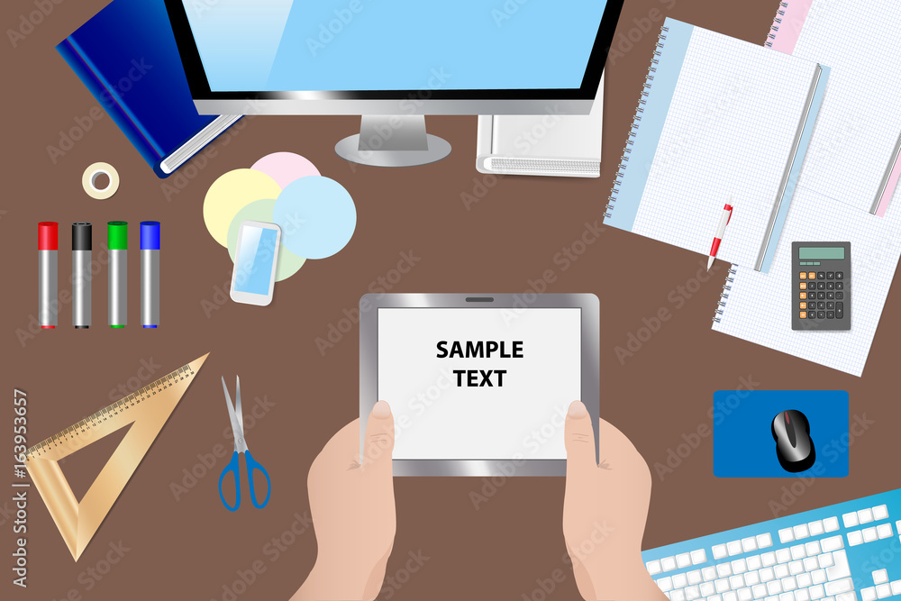 Top view of the table with school supplies. Above them, hands hold a tablet with a blank screen ready for your text. Top view of the table with school supplies. Above them, hands hold a tablet with a blank screen ready for your text.