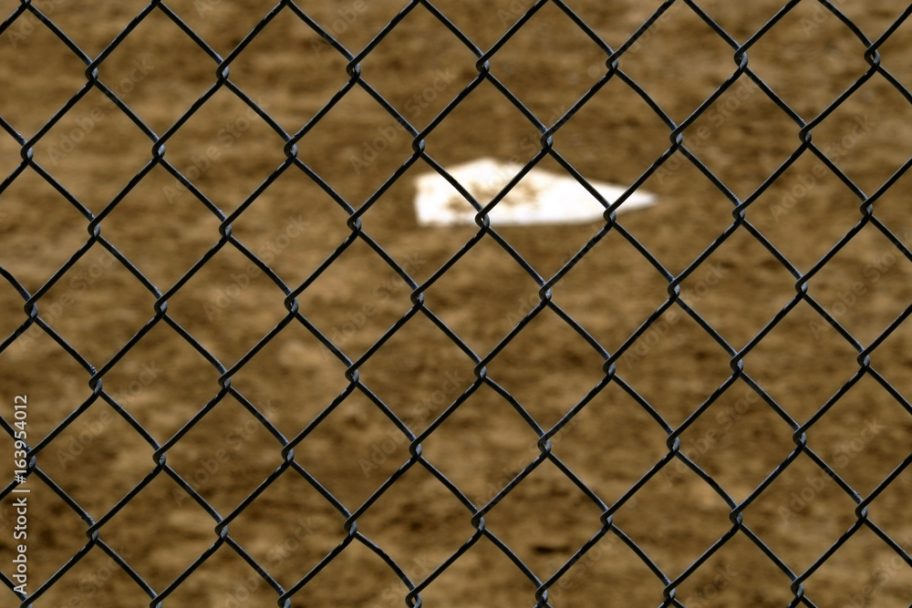 Fototapeta premium Baseball Home Plate and Backstop Fence