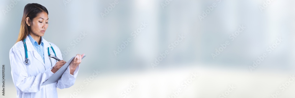 Doctor holding files and folders with blurred background Doctor holding files and folders with blurred background